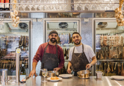 The two owners of Norcino, Arnolfo and Fabio, behind the Deli counter