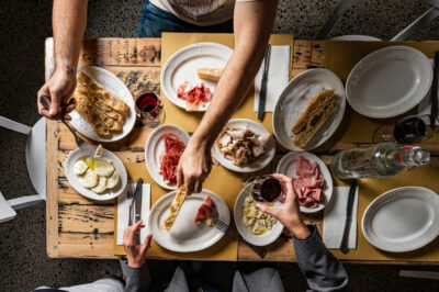 people eating shared Italian food